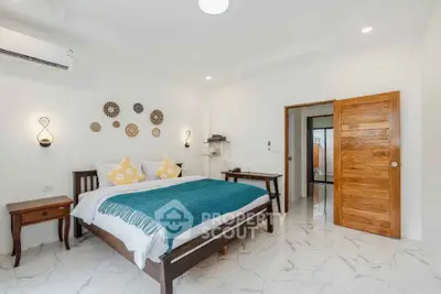 Spacious bedroom with modern decor and elegant wooden accents