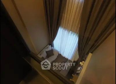 Luxurious living room with high ceilings and elegant curtains