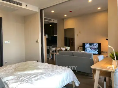 Modern studio apartment with cozy living area and stylish decor