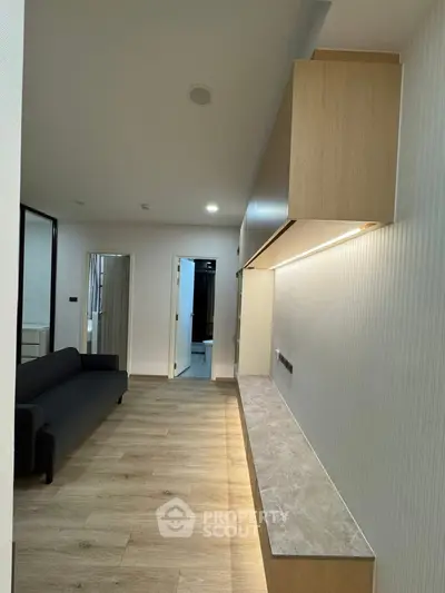 Modern living room with sleek design and wooden flooring