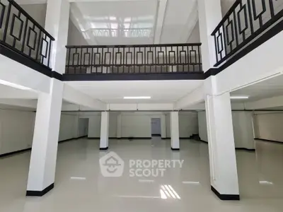 Spacious open-plan interior with mezzanine and modern design, ideal for versatile use.