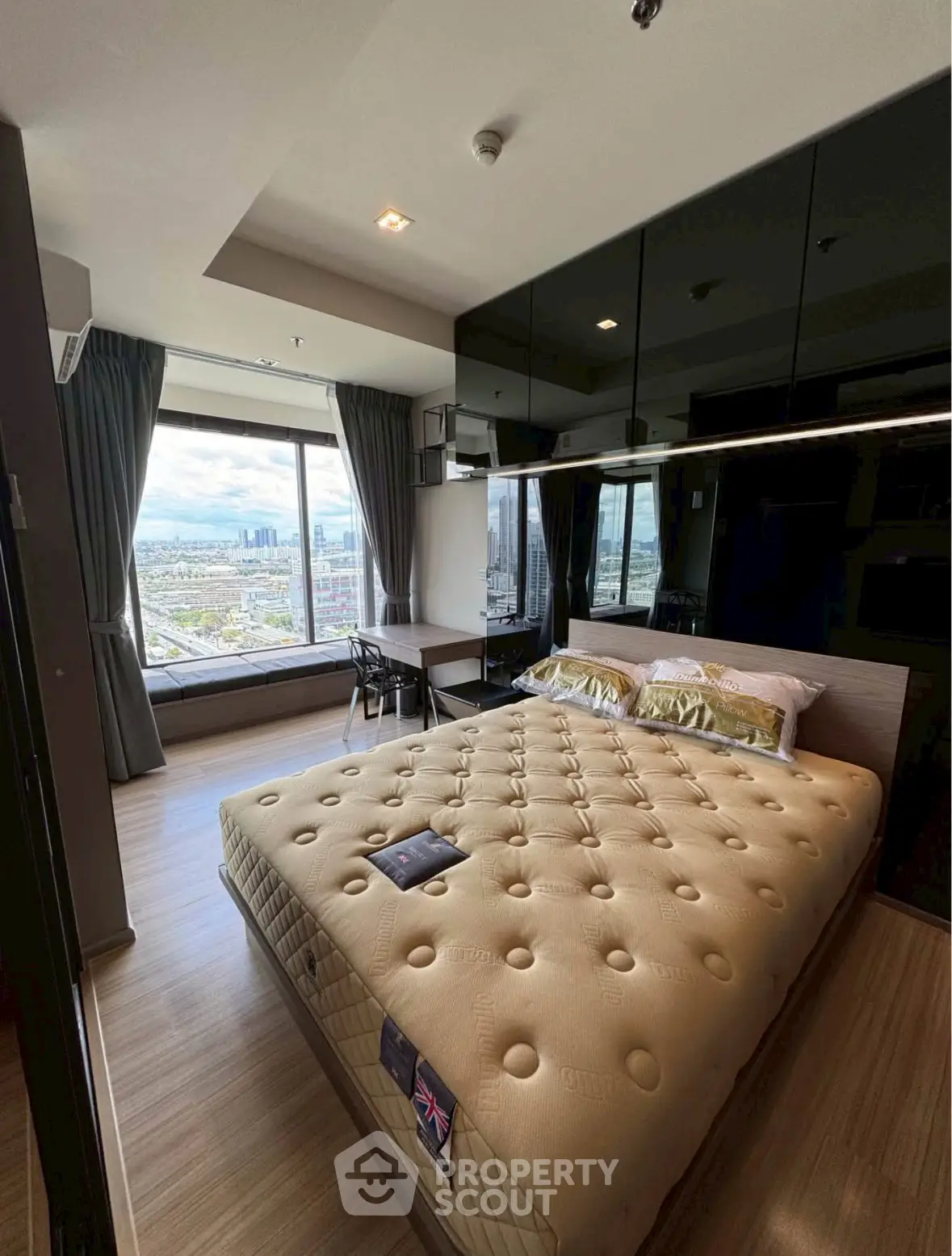 Luxurious bedroom with stunning city view and modern furnishings
