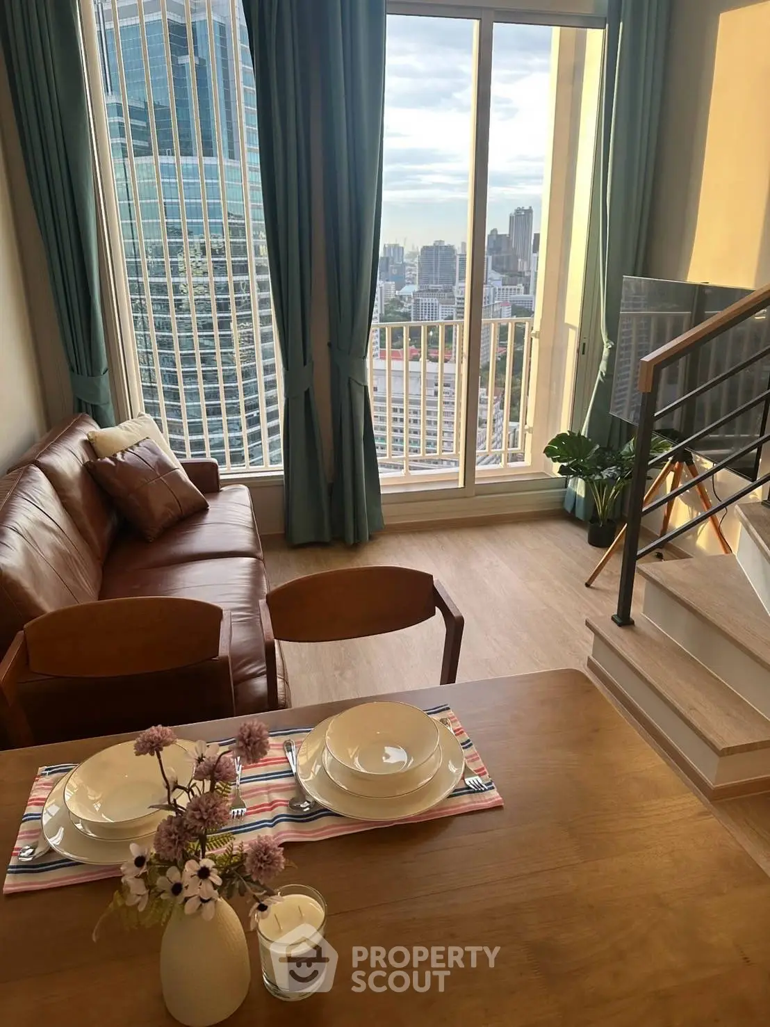 Modern living room with city view, featuring stylish furniture and elegant decor, perfect for urban living.