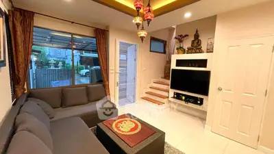 Charming living room with modern decor and cozy seating, perfect for relaxation and entertainment.