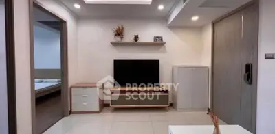 Modern living room with sleek TV unit and minimalist decor