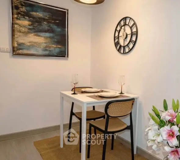 Cozy dining nook with modern decor and elegant table setting in a stylish apartment.