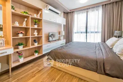 Spacious modern bedroom with elegant decor and natural light