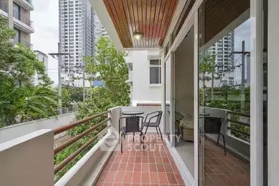 Charming balcony with city view, perfect for relaxation and outdoor dining.