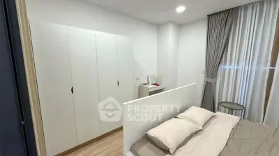 Modern bedroom with sleek wardrobe and cozy bed in stylish apartment