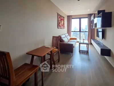 Modern living room with city view, featuring stylish furniture and wall-mounted TV unit.