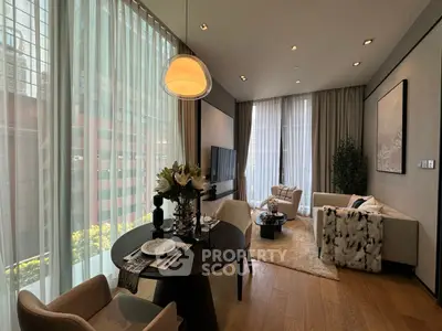 Luxurious modern living room with floor-to-ceiling windows and elegant decor in a high-rise apartment.
