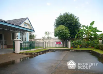 Charming suburban house with lush garden and spacious driveway for sale.