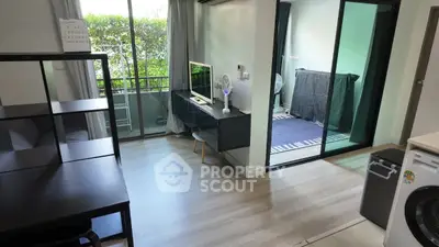 Modern living room with balcony and washing machine in a stylish apartment