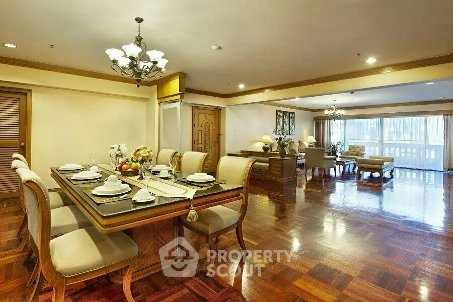 Spacious open-plan living and dining area with elegant wooden flooring and stylish decor.