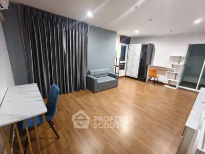 Spacious modern living room with wooden flooring and stylish furniture
