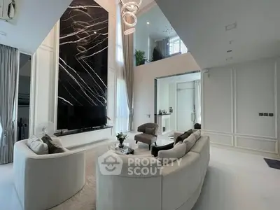 Luxurious modern living room with high ceilings and elegant decor