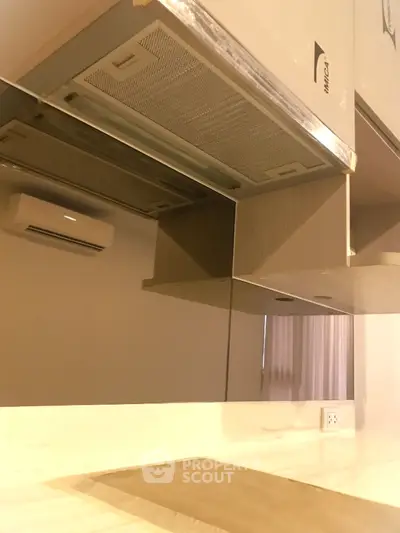 Modern kitchen with sleek cabinetry and built-in appliances