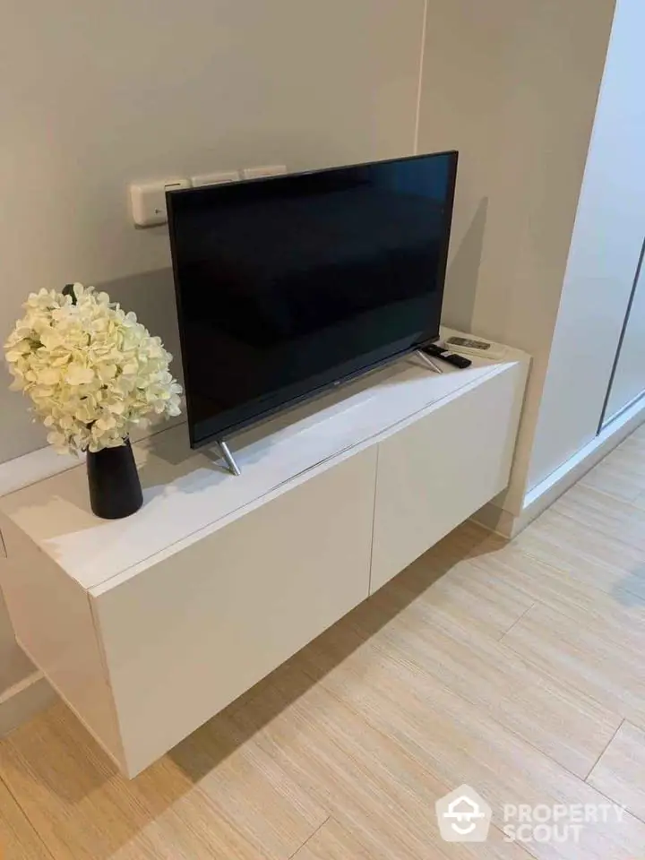 Modern living room with sleek TV stand and elegant decor