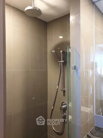 Modern bathroom with sleek shower design and glass partition