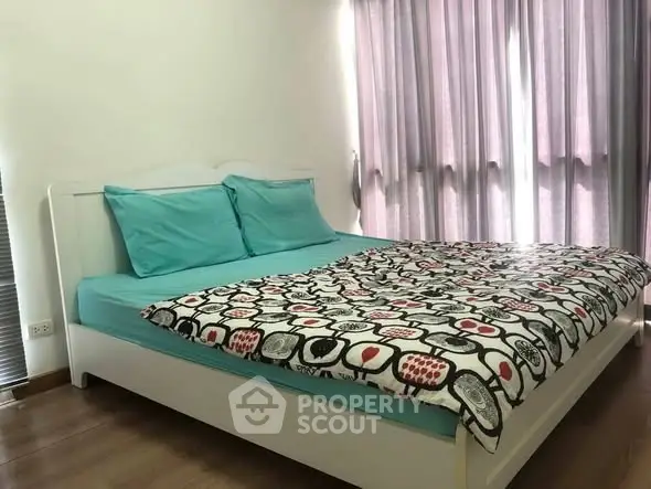 Cozy bedroom with modern decor and ample natural light