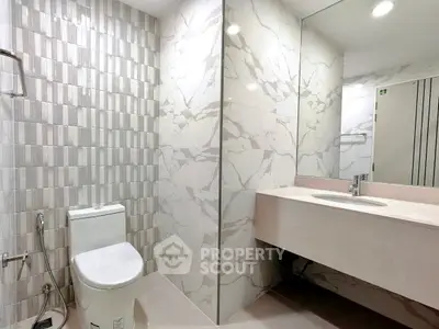 Modern bathroom with elegant marble tiles and sleek fixtures