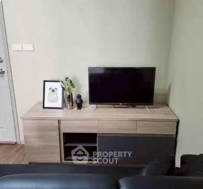 Modern living room with sleek TV stand and decor accents