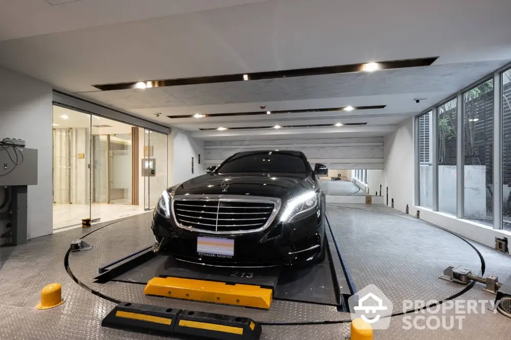 Luxury car in modern automated parking system with sleek design and advanced technology.