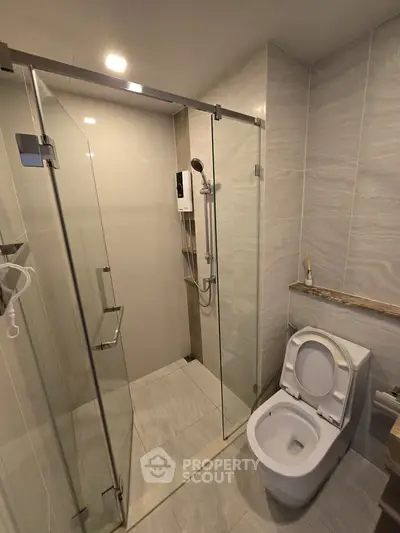 Modern bathroom with glass shower and sleek toilet design