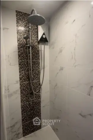 Modern bathroom shower with elegant tile design and rainfall showerhead