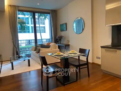 Modern living room with dining area, large window, and stylish decor in urban apartment.