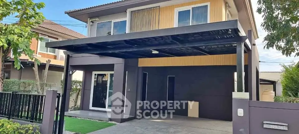 Modern two-story house with covered carport and landscaped front yard in a suburban neighborhood.