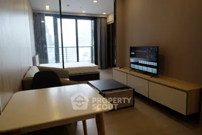 Modern studio apartment with sleek furniture and city view, perfect for urban living.