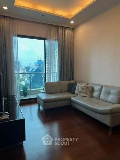 Modern living room with city view and stylish furniture