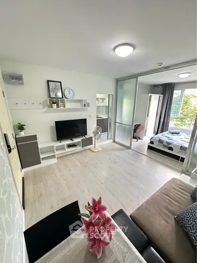 Modern open-plan living room with stylish decor and natural light