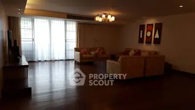 Spacious living room with elegant decor and large windows for natural light.
