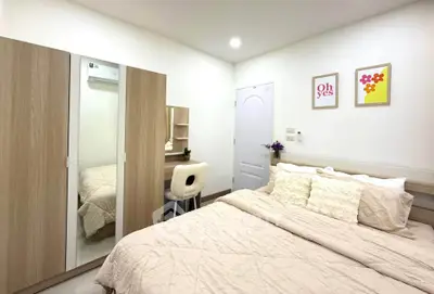 Cozy bedroom with modern decor and ample storage space