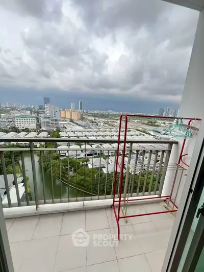 Stunning balcony view overlooking cityscape with ample space for relaxation and outdoor activities.
