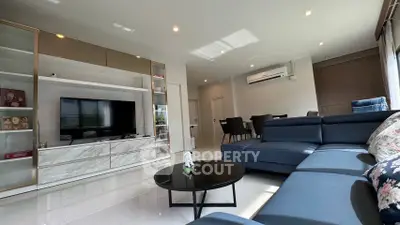 Spacious modern living room with sleek furniture and natural light