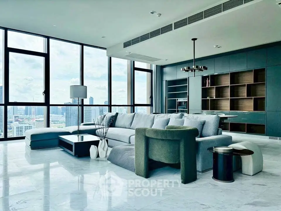 Luxurious modern living room with panoramic city views and elegant furnishings.