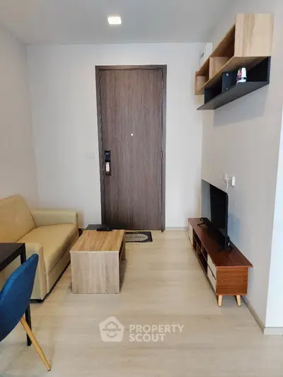 Modern living room with stylish furniture and wooden flooring