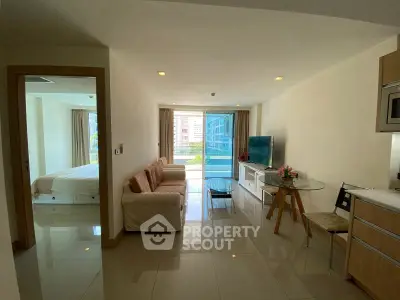 Modern living room with open layout and balcony view in a stylish apartment