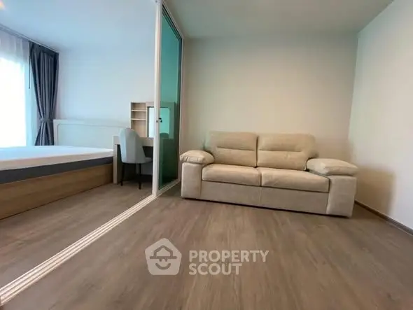 Modern apartment with cozy living area and stylish bedroom