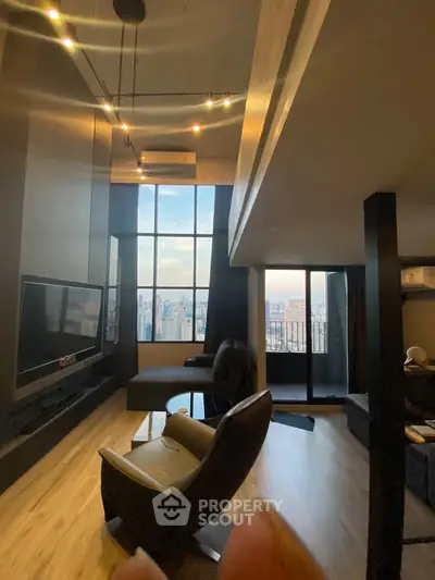 Luxurious high-rise living room with stunning city view and modern furnishings.