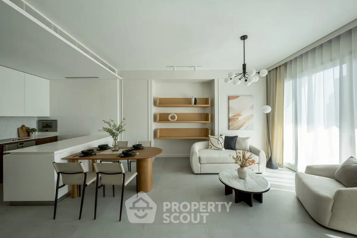Modern open-plan living room with stylish furniture and natural light