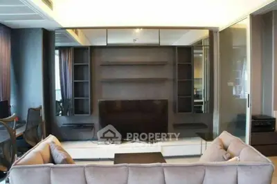 Modern living room with sleek entertainment center and cozy sofa