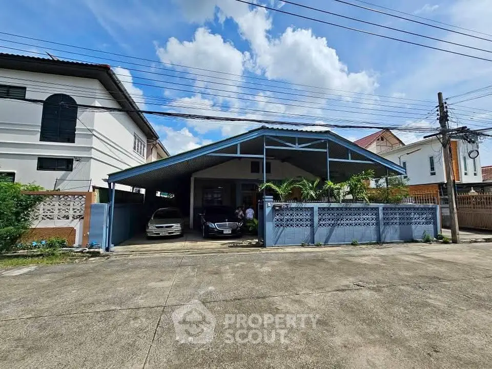 Spacious residential property with covered parking and charming exterior in a serene neighborhood.