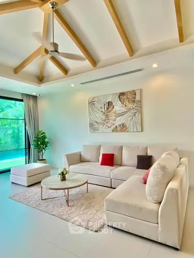 Luxurious living room with modern decor and pool view
