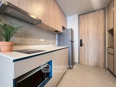 Modern kitchen with sleek appliances and stylish cabinetry