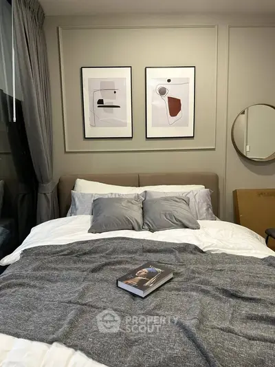 Cozy modern bedroom with stylish decor and comfortable bedding, perfect for relaxation and rest.