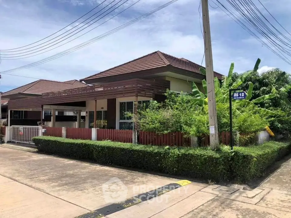 Charming suburban house with lush greenery and modern design in a peaceful neighborhood.